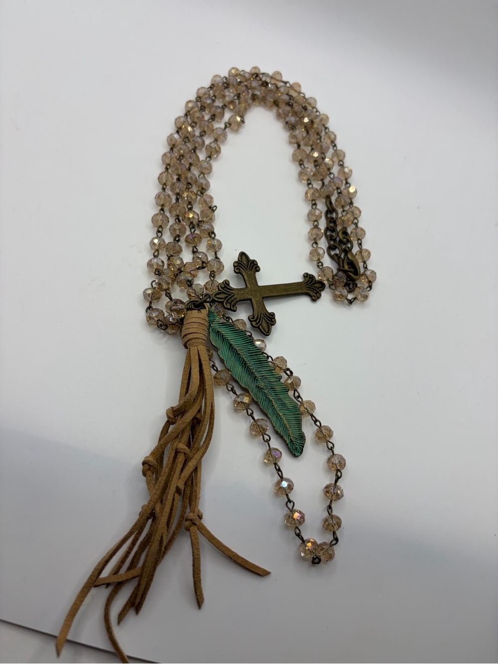 Double beaded necklace w/metal feather,cross and leather tassel